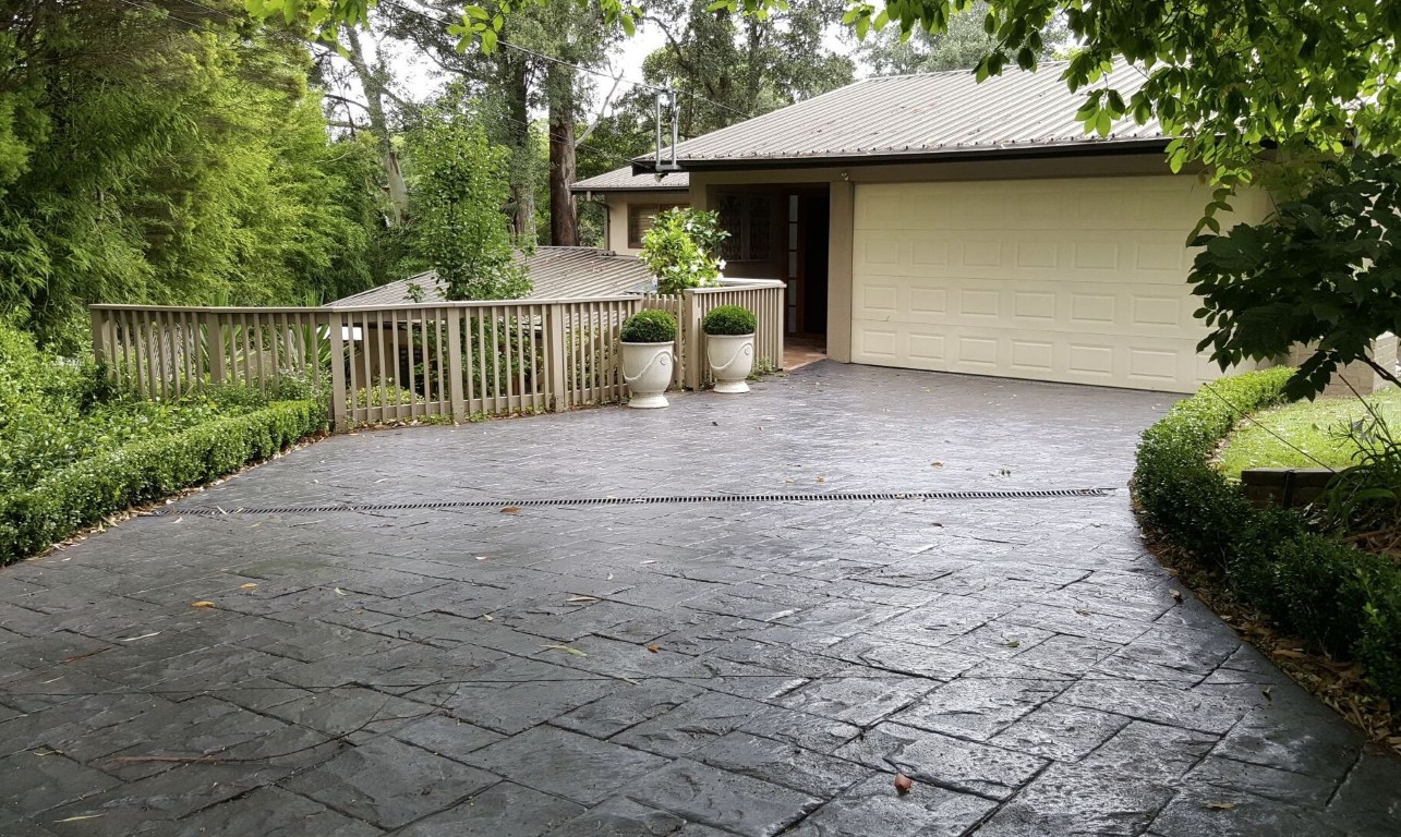 Decorative stamped concrete pool deck installation in Burien, WA