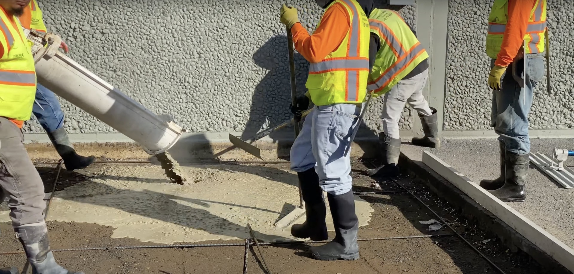 Large-scale concrete construction project showing aerial view of concrete pour
