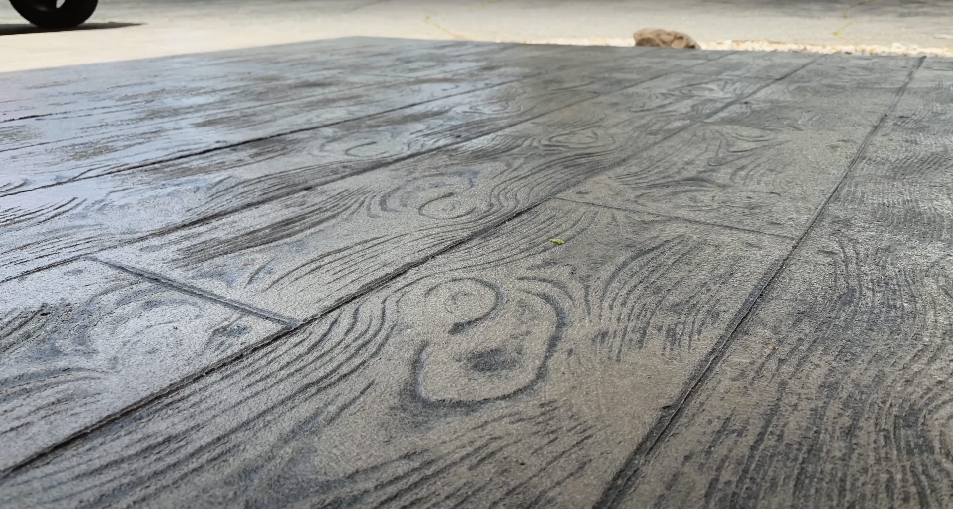 Beautiful wood-grain stamped concrete surface with natural texture by Burien Concrete
