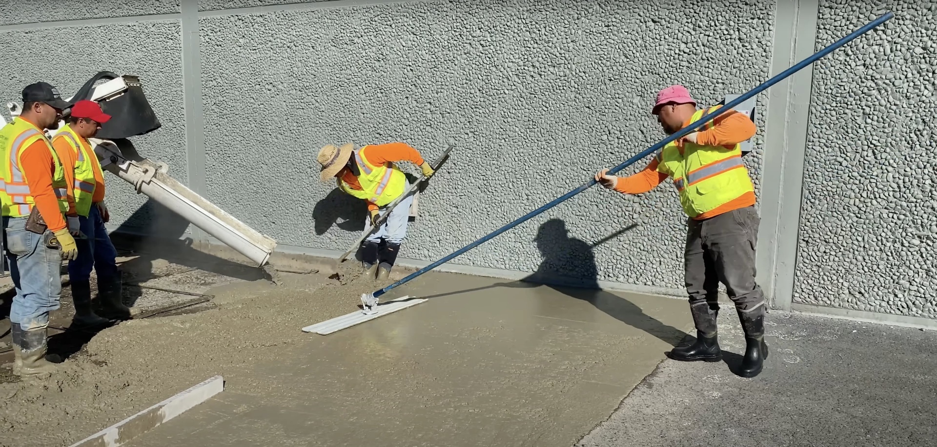Advanced concrete placement and leveling using laser-guided screed equipment for precision results